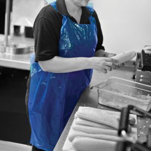 DB01/B Shield® Blue Longer Length Disposable Aprons in a Pack